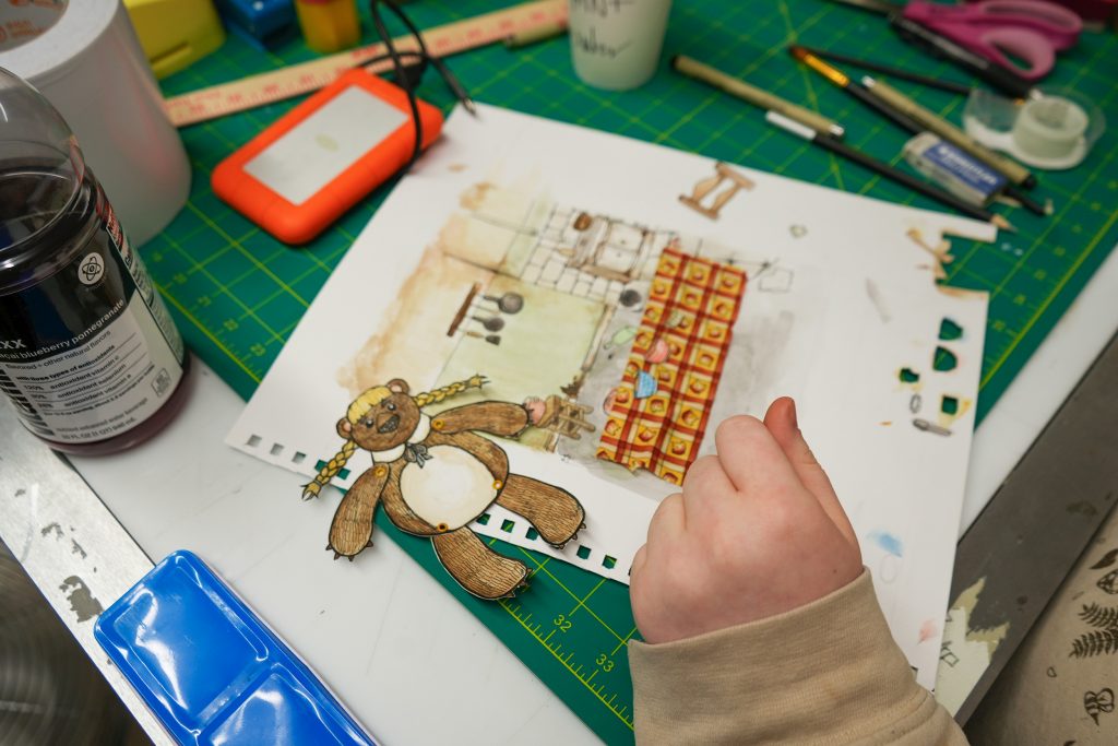 A student works on a drawing. In addition to hand drawings, the films employed digital art, puppetry, stop motion animation, and more to tell their stories. Original music, sound effects, and voiceovers were produced in PNCA’s own recording studio. 